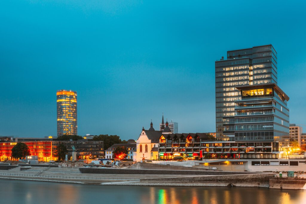 Cologne, Germany. Modern Building On Embankment During Summer Evening Night